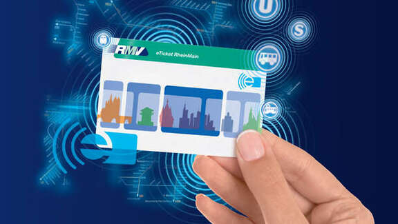 Hand holding eTicket a hand holding the eTicket card, blue background